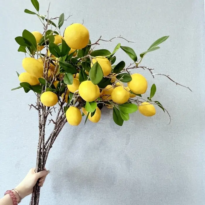 Branche de citron artificielle à feuilles vertes