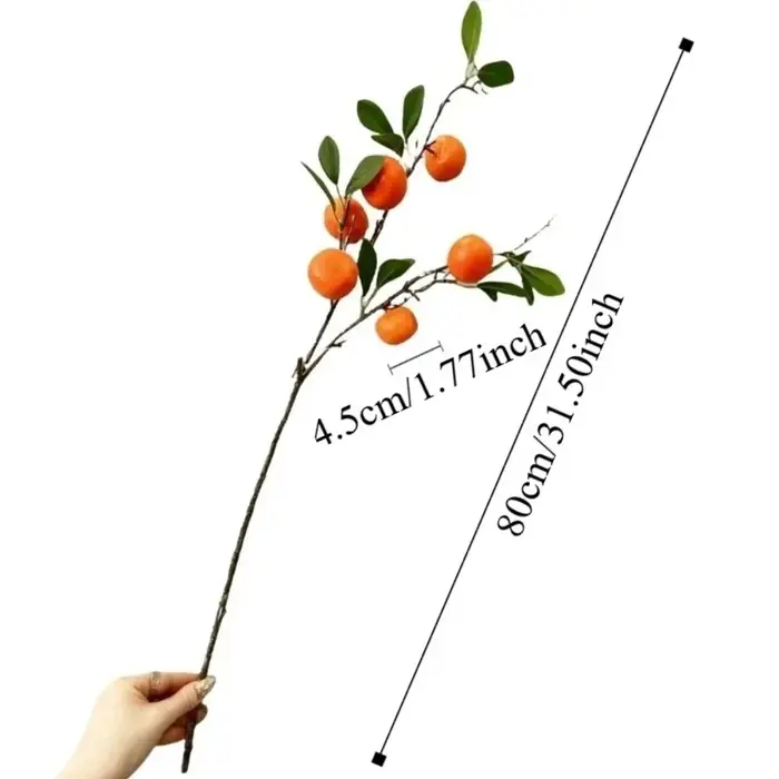 Branche d'orange artificielle avec feuilles vertes réalistes