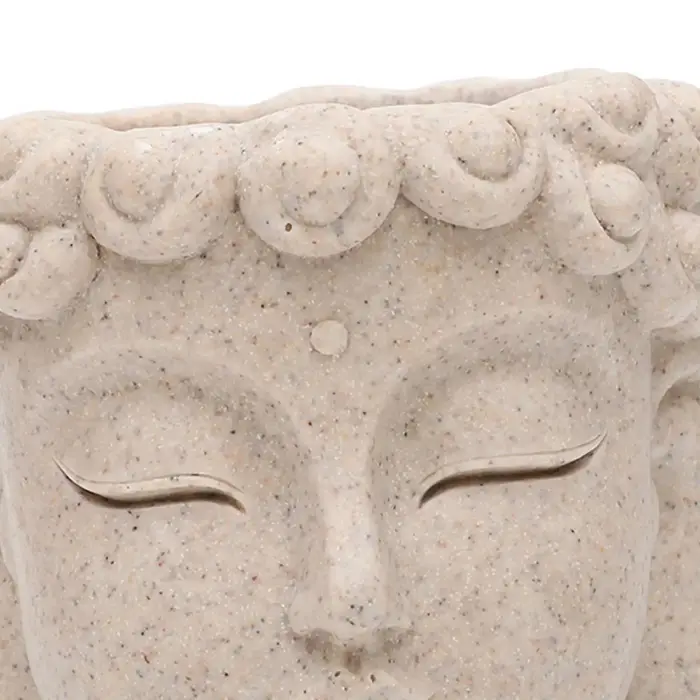 Pot de fleurs en forme de tête de Bouddha