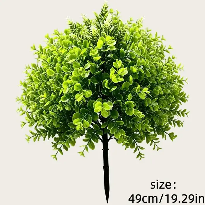 Plantes vertes artificielles sur piquet