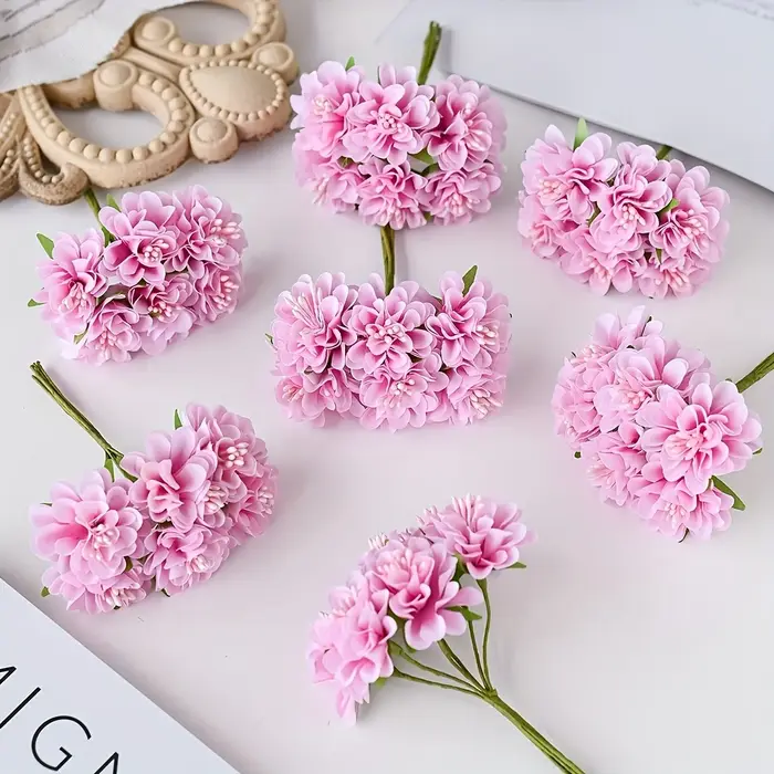 Oeillet de fleurs en soie simulée