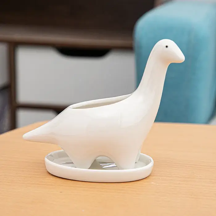 Pot de fleur de dinosaure en céramique blanche