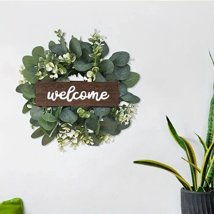 Couronne d'eucalyptus vert avec signe de bienvenue