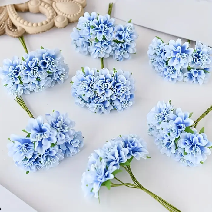 Oeillet de fleurs en soie simulée