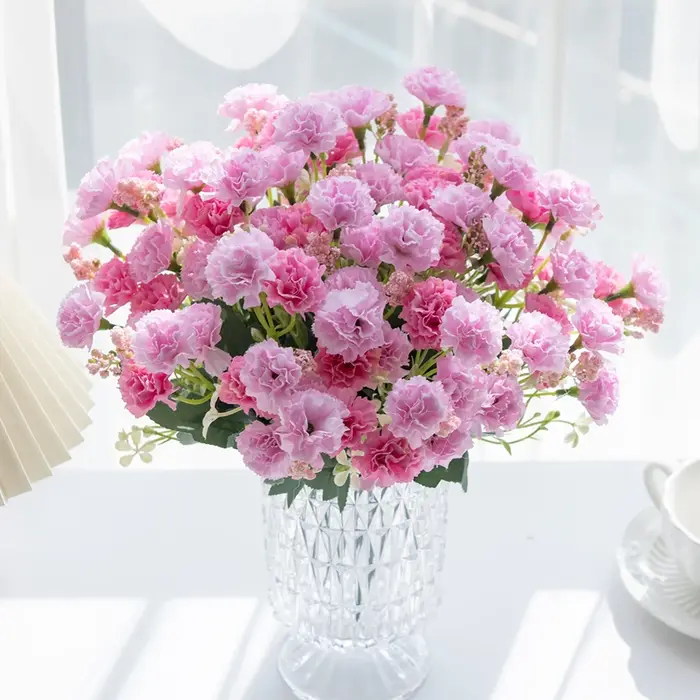Couronne d'oeillets de fleurs artificielles
