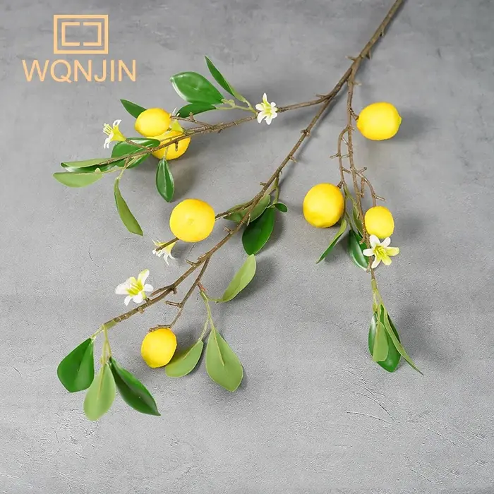 Branche de fruits de citron de luxe avec feuilles vertes