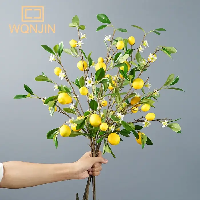 Branche de fruits de citron de luxe avec feuilles vertes