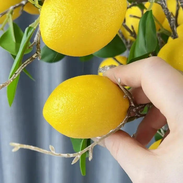 Feuilles vertes, branche de citron artificielle
