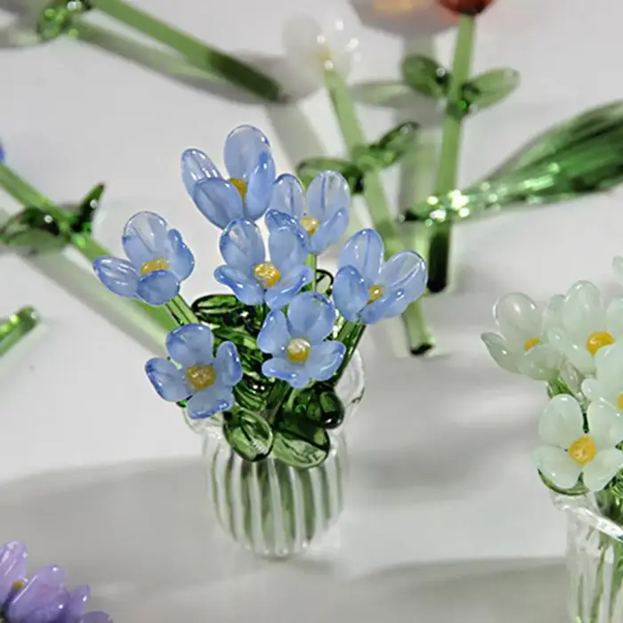Bouquet de fleurs en verre avec vase