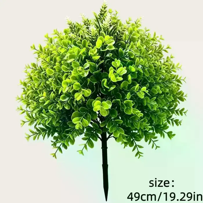 Plantes vertes artificielles sur piquet