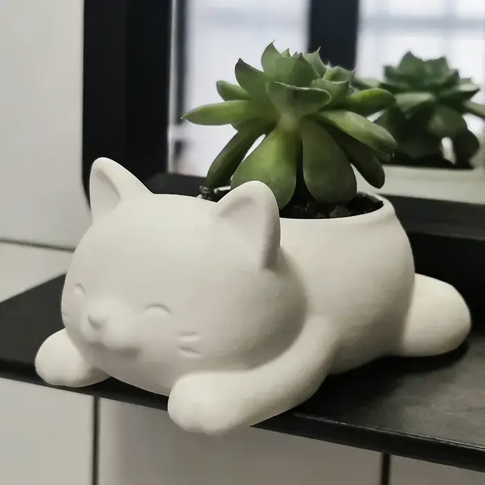 1 pot de fleurs en forme de chat couché de style dessin animé