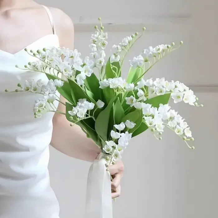 Bouquet de fleurs artificielles de lys blancs du val