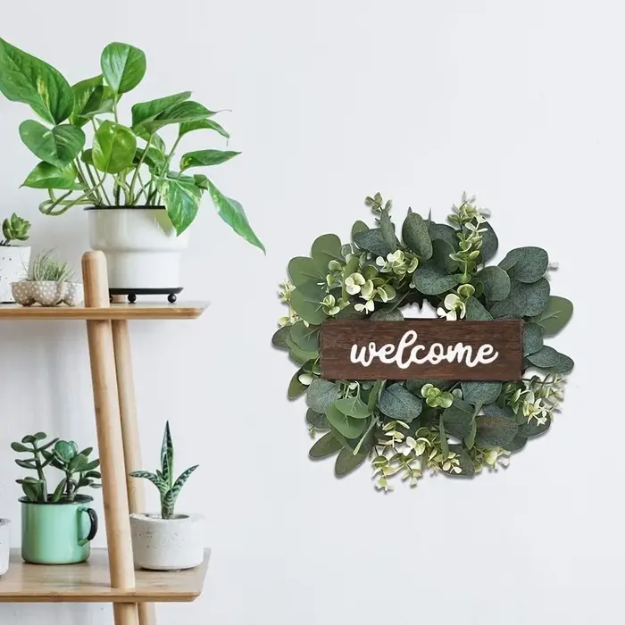 Couronne d'eucalyptus vert avec signe de bienvenue