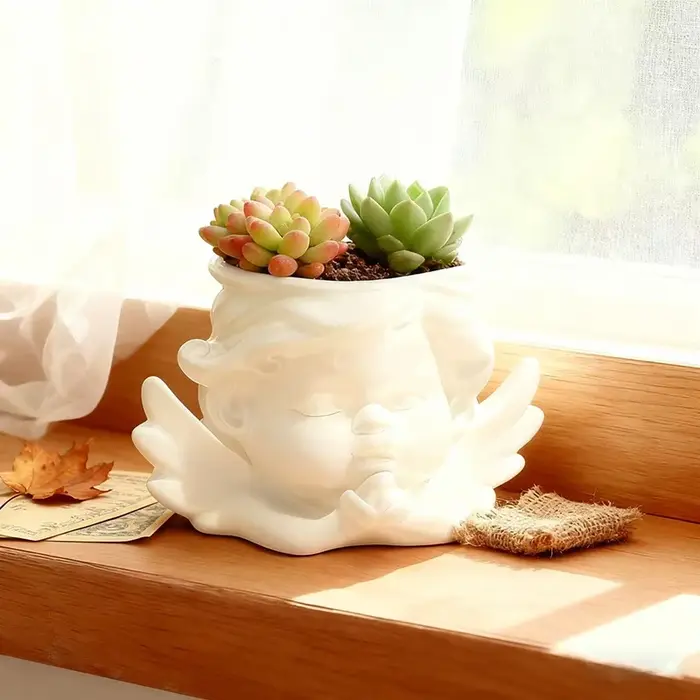 Joli pot de fleurs en forme d'ange