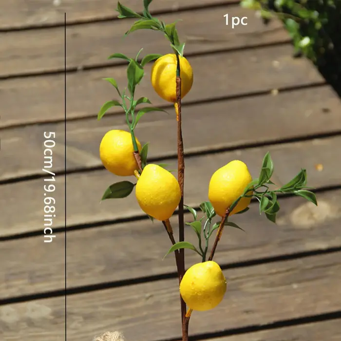 Branche de fruits de citron de luxe avec feuilles vertes